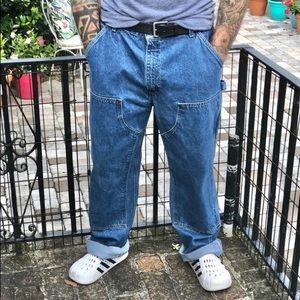 Vans shoes in green and Carhartt jeans